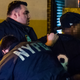 Man being arrested outside the Buccaneer Diner.